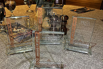 Copper Anvil awards sitting on table