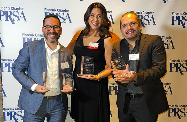 EdPlus team members holding the awards following the awards ceremony.