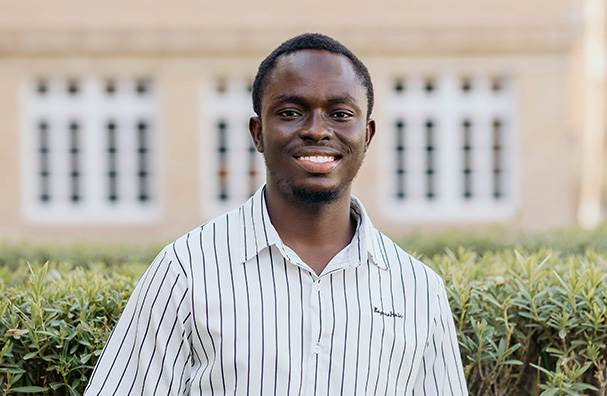 man in striped shirt smiling