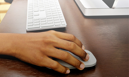 hand on computer mouse